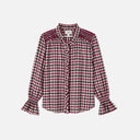 Blusa de cuadros en tonos berry, negro y blanco confeccionada en 100% algodón. El cuello, el smock y los acabados ondulados aportan un toque femenino y distintivo a este diseño.