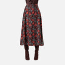 Falda midi estampada de Surkana con flores en tonos burdeos y verde petróleo.