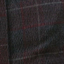 Detalle del tejido con estampado de cuadros en tonos oscuros del pantalón PAN.
